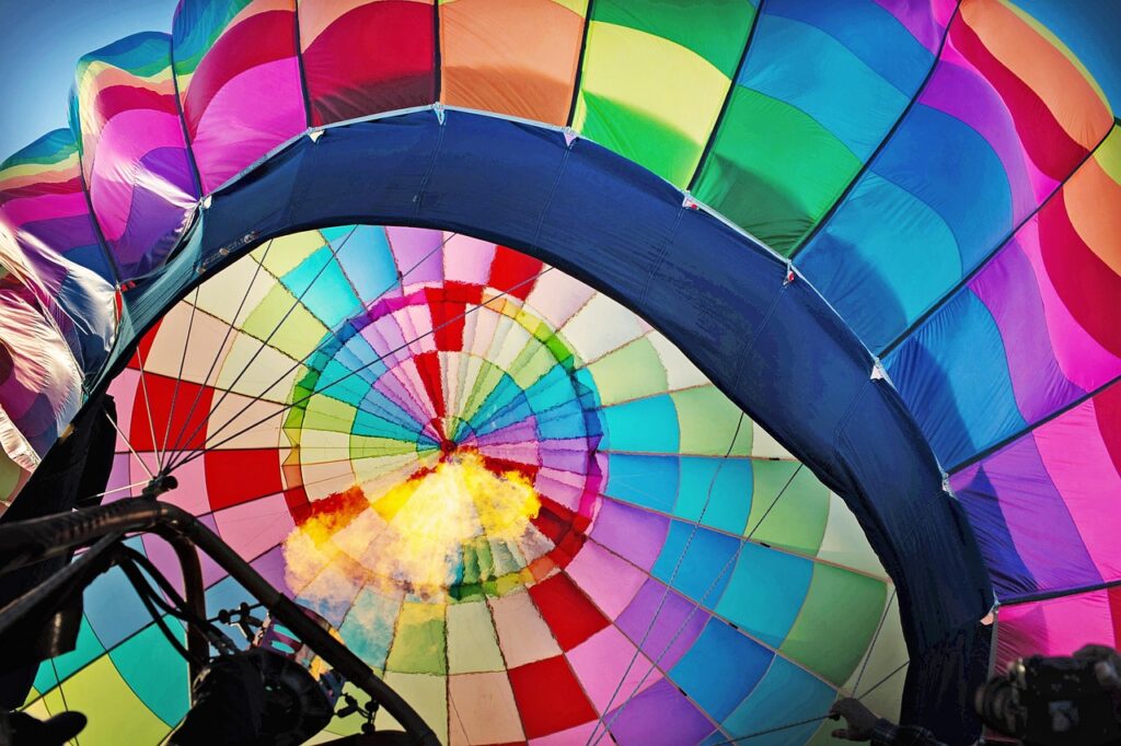 hot air balloon, inflating, inflate, blower, inside balloon, nature, setting up, launching, launch, rainbow, colourful, colorful